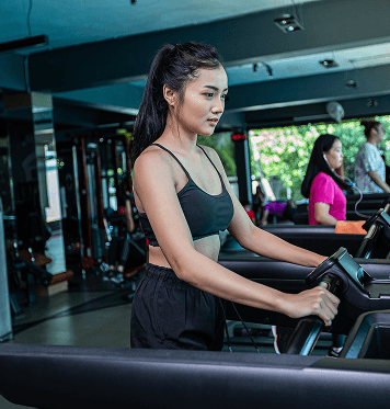 Member using treadmill equipment for cardio workouts at Ogunquit Fitness Center