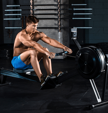 Member using a rowing machine for cardio and endurance training at Ogunquit Fitness Center