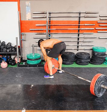 Member performing barbell deadlift training at Ogunquit Fitness Center